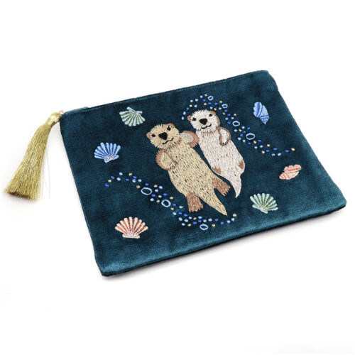 A dusky teal blue cotton velvet zip purse featuring embroidered otters and sea shells, finished with a metallic gold tassel.